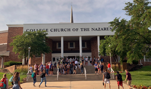 students going up stairs to the entrance of college church of the nazarene