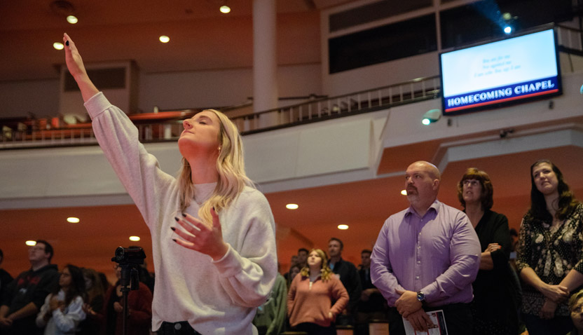 Spiritual Life Event at College Church, Student with raised hand