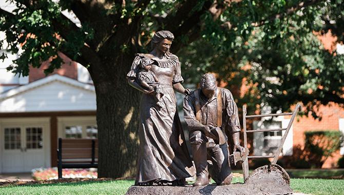 The Harvest Prayer sculpture anchors the campus. It is in the center of the mall in the Prayer Circle.