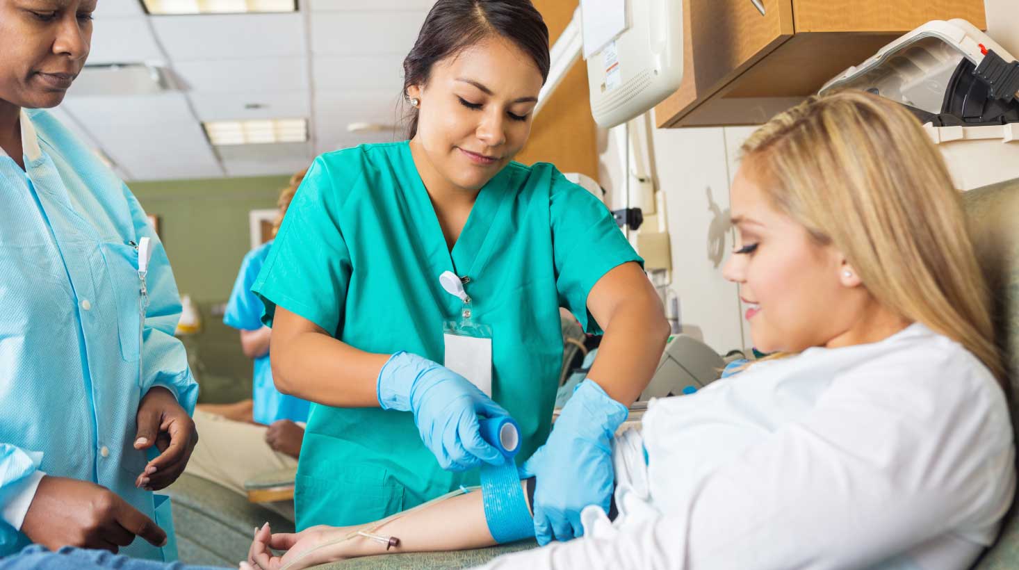 Nurse installing an IV