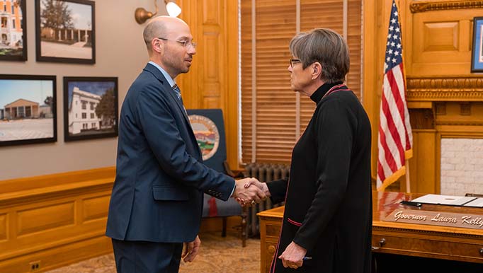 Andrew Secor shaking hands with Gov. Laura Kelly