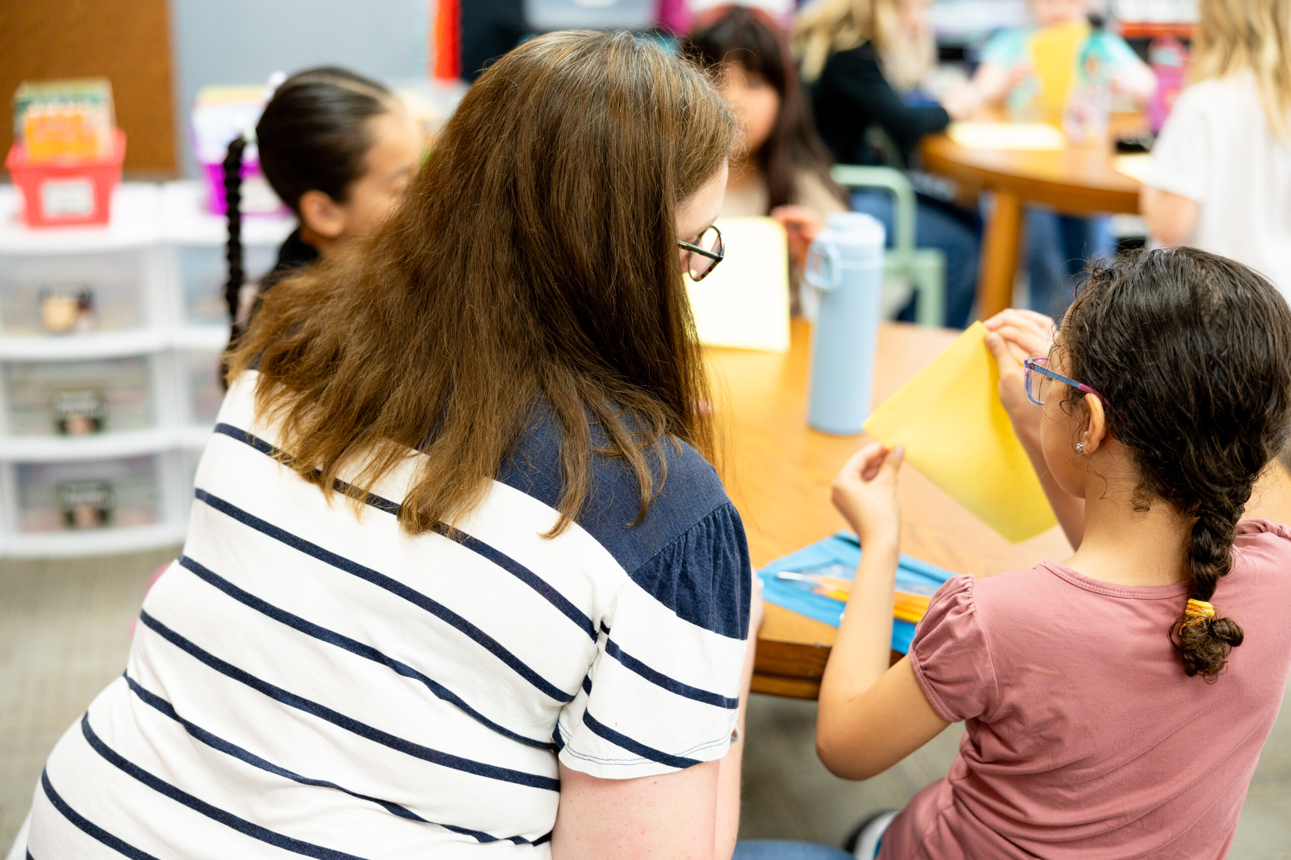Elementary school teacher in a classroom with children