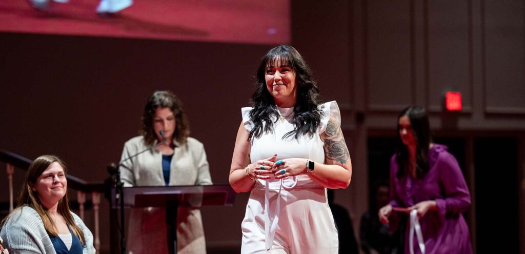 Danielle-Hertzler-crosses-stage-at-Nurses-Pinning