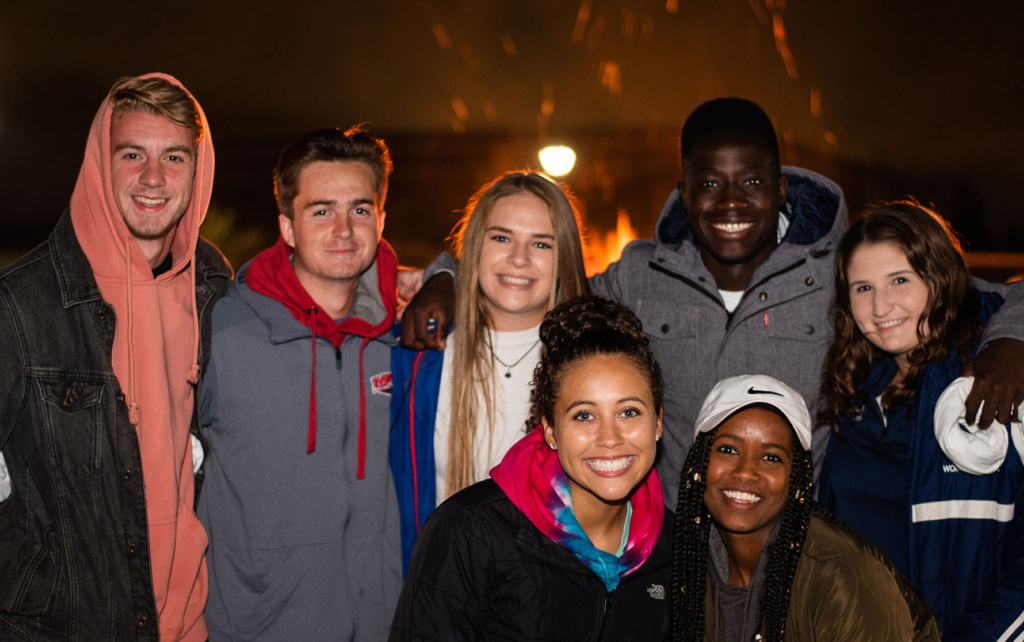 Students at an evening event on the campus mall