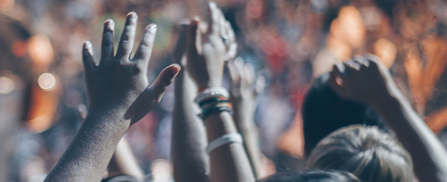 Children's hands raised in worship