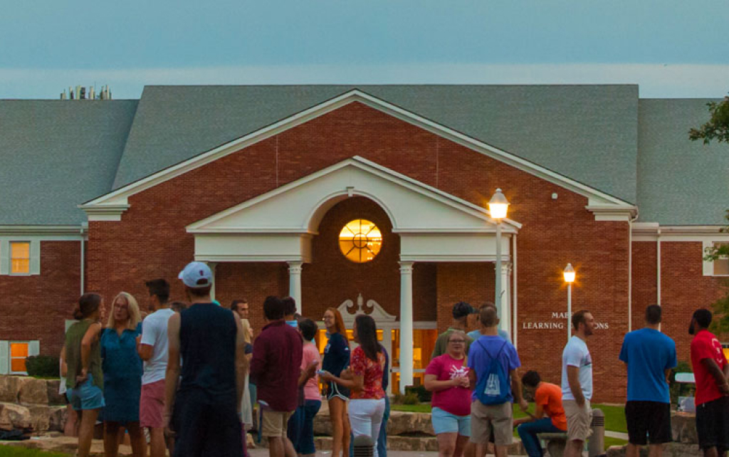 Students gather on campus mall in front of Mabee Learning Center