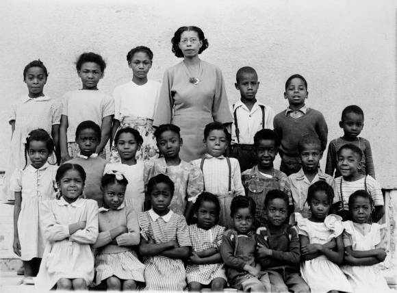 Madam C. J. Walker School class photo, featuring 22 African American school children and their teacher. Photo curtesy of jocohistory.org