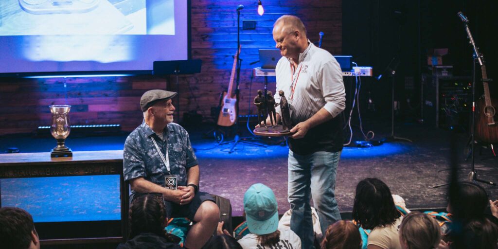 Mickey Cox is presented the Passion to Serve award at The Call