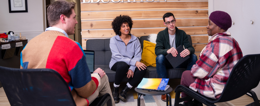 Four people in a group speaking about counseling