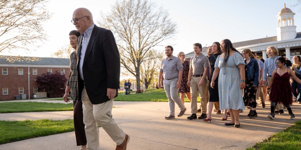 David and Donna Spittal lead students across campus