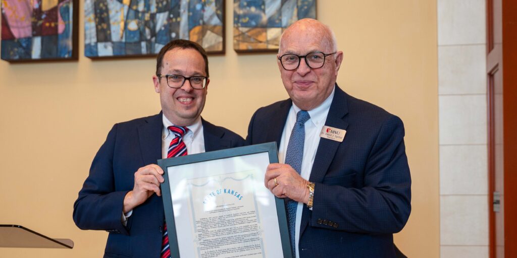 Matt Lindsey, left, presents Dr. Spittal with Kansas Senate Proclamation.