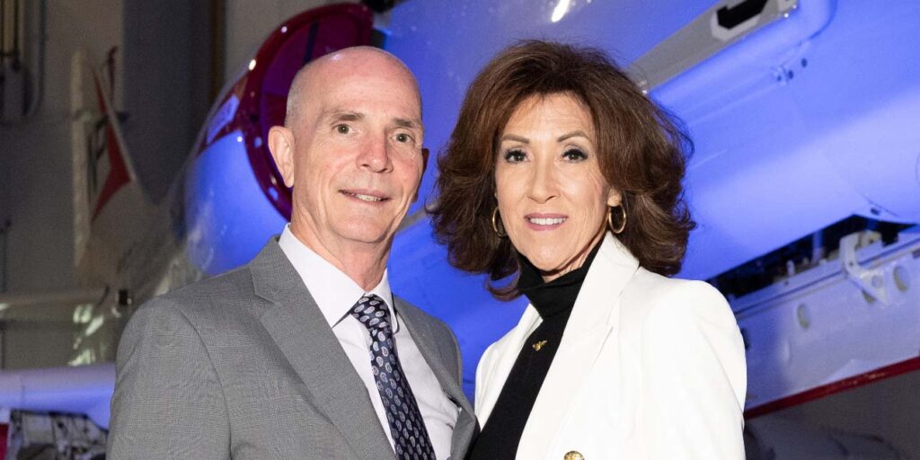 Captains Dean and Tammie Jo Shults in front of a small plane