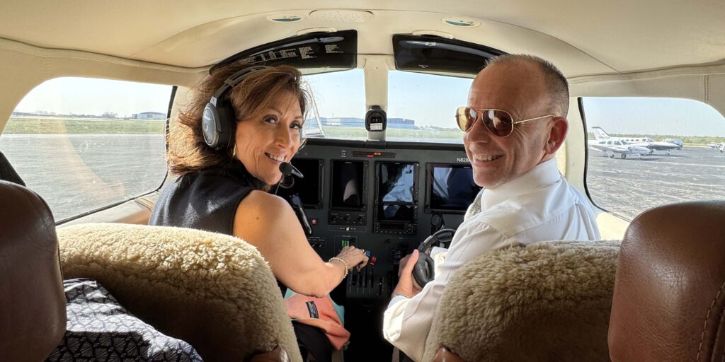 Tammie Jo Shults and Mike Goeke in cockpit of a small airplane