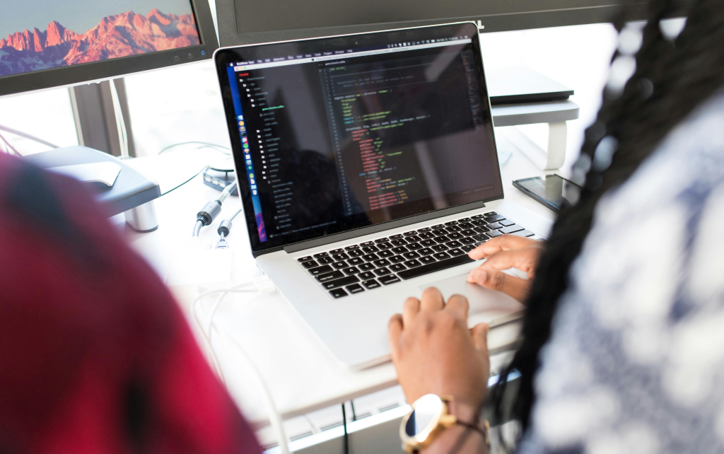 Closeup of a person coding on a computer