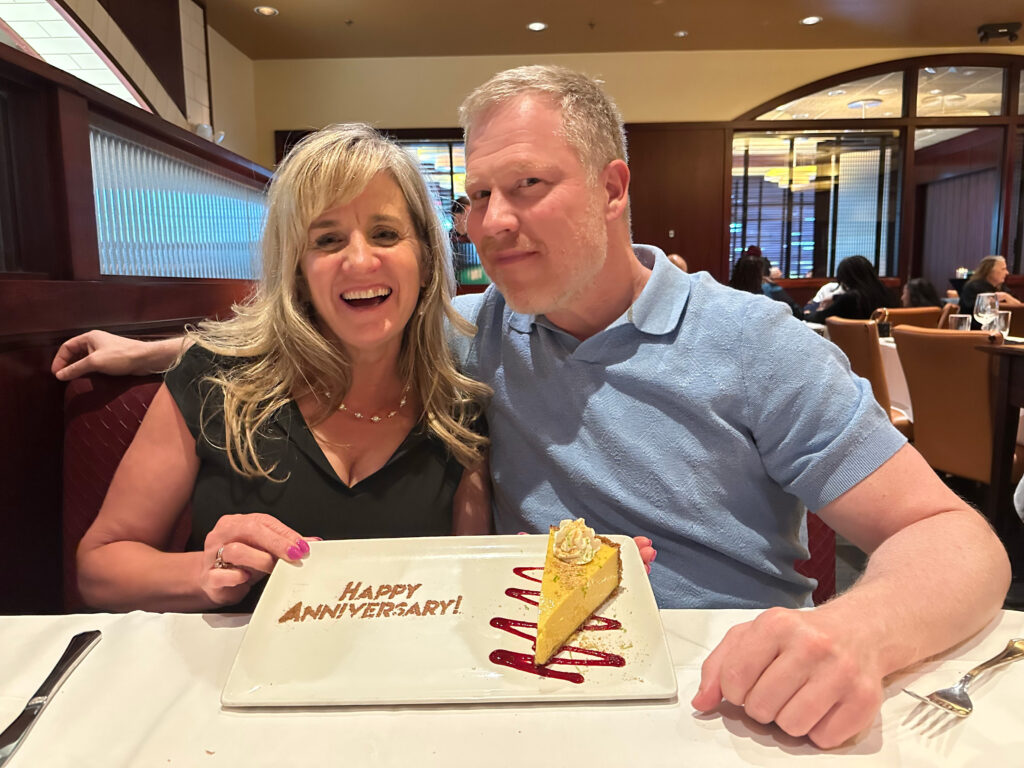 Lisa and Jerry Wallentine celebrating their anniversary at a restaurant.