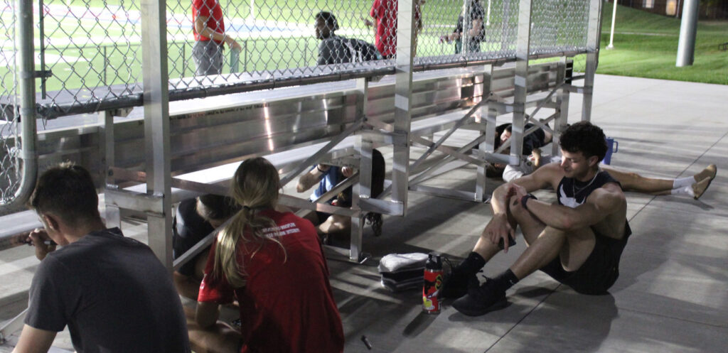 ASA members writing scripture verses on the visitors' bleachers at MNU.