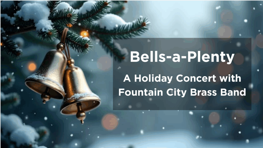 two gold bells hanging from a pine tree