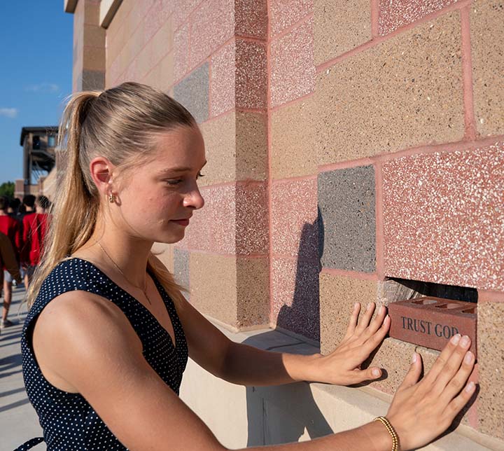 Lakin Essex places Trust God Brick in Copeland Athletic Complex