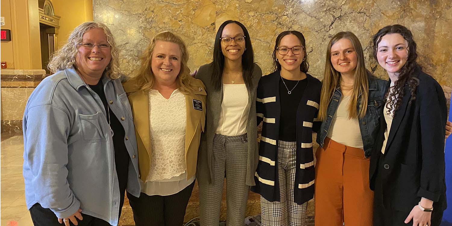 MNU Director of Student Life Lisa Downs, Kansas Representative and MNU Alumna Robyn Essex, with MNU students Tiyana Washington, Tia Washington, Claire Debok and Gracelyn Duncan in the State Capitol.
