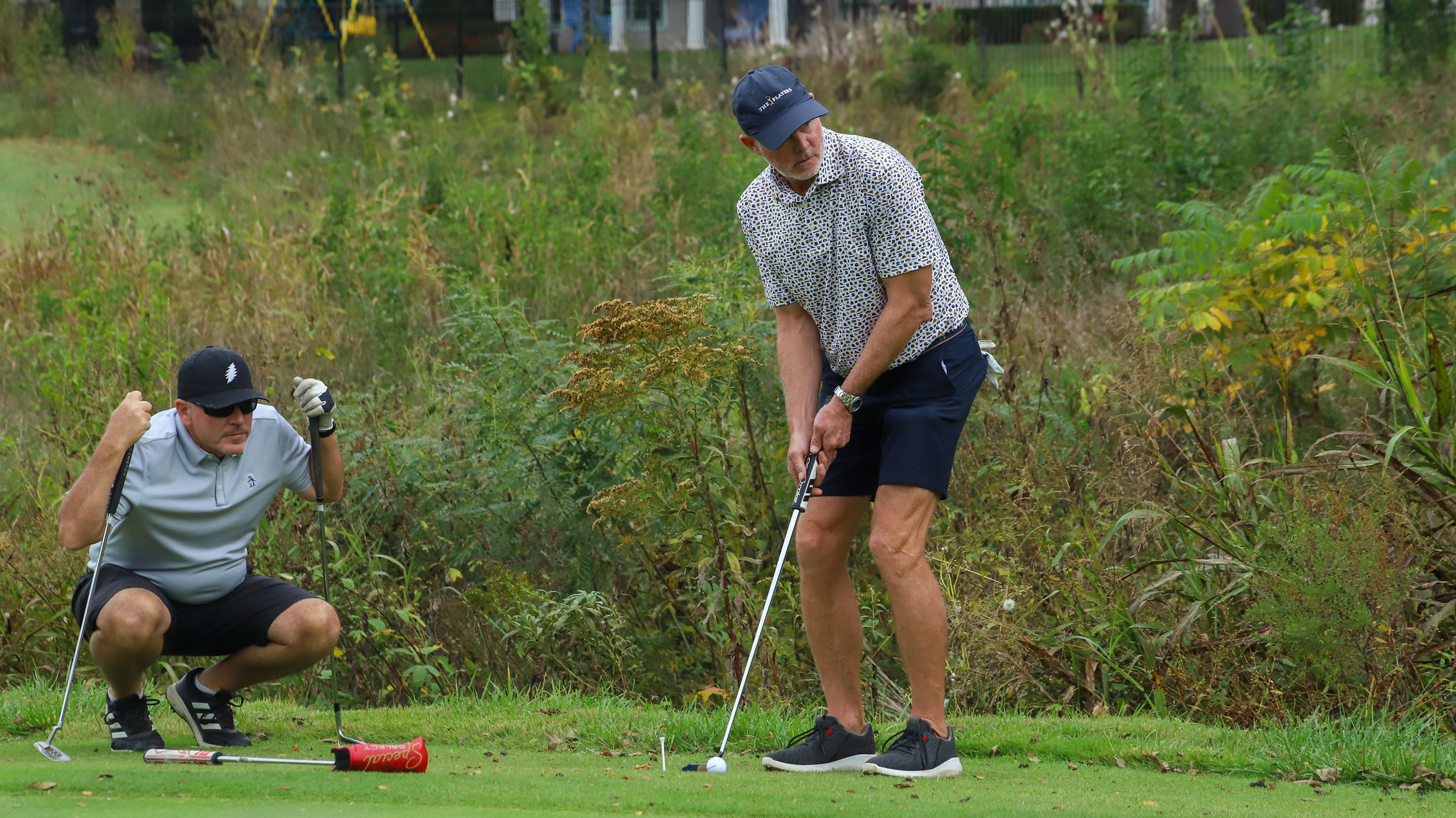 Participants in MNU's 2025 Pioneer Golf Classic putting on the green
