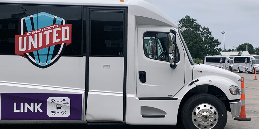 Close up of one of the buses with the UNITED logo.