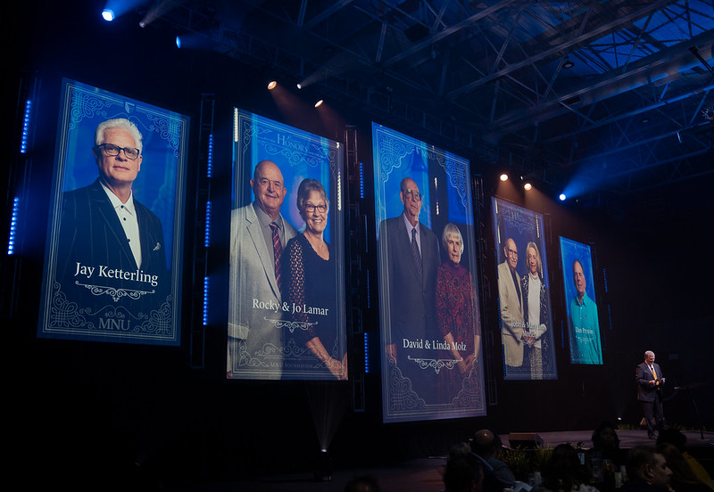 The Cornerstone Society presentation at the 2026 President's Honors Awards scholarship fundraising event, featuring banners of Cornerstone Society members over the event stage