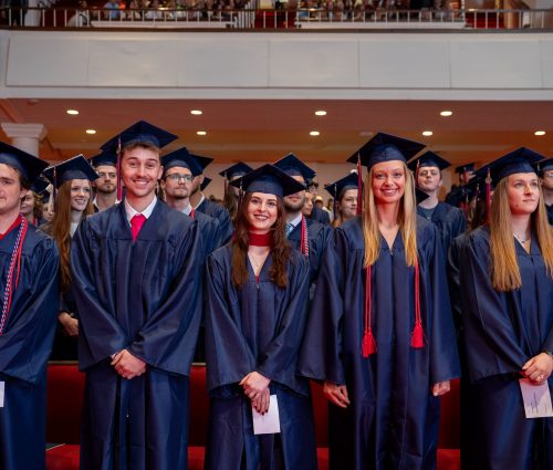 Image of students in cap and gown at 2026 graduation.
